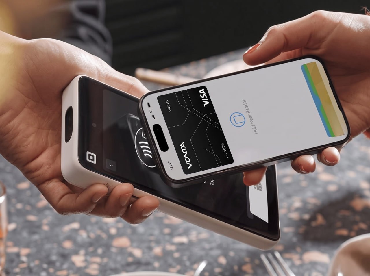 Paying with VantaCard through Apple Pay by tapping an iPhone on a card reader